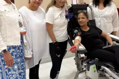 APS Womens Council alongside Preeti Suneja as she donates blood.